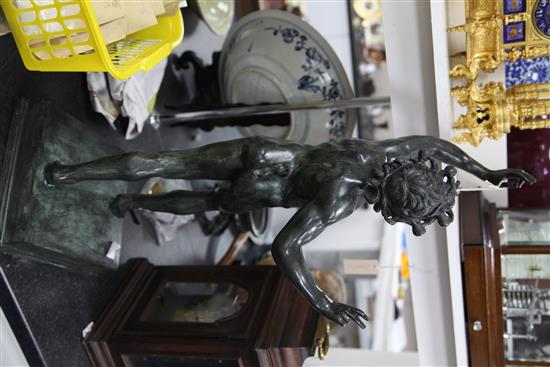 After the antique. A modern green patinated bronze model of a dancing faun, 32.5in.